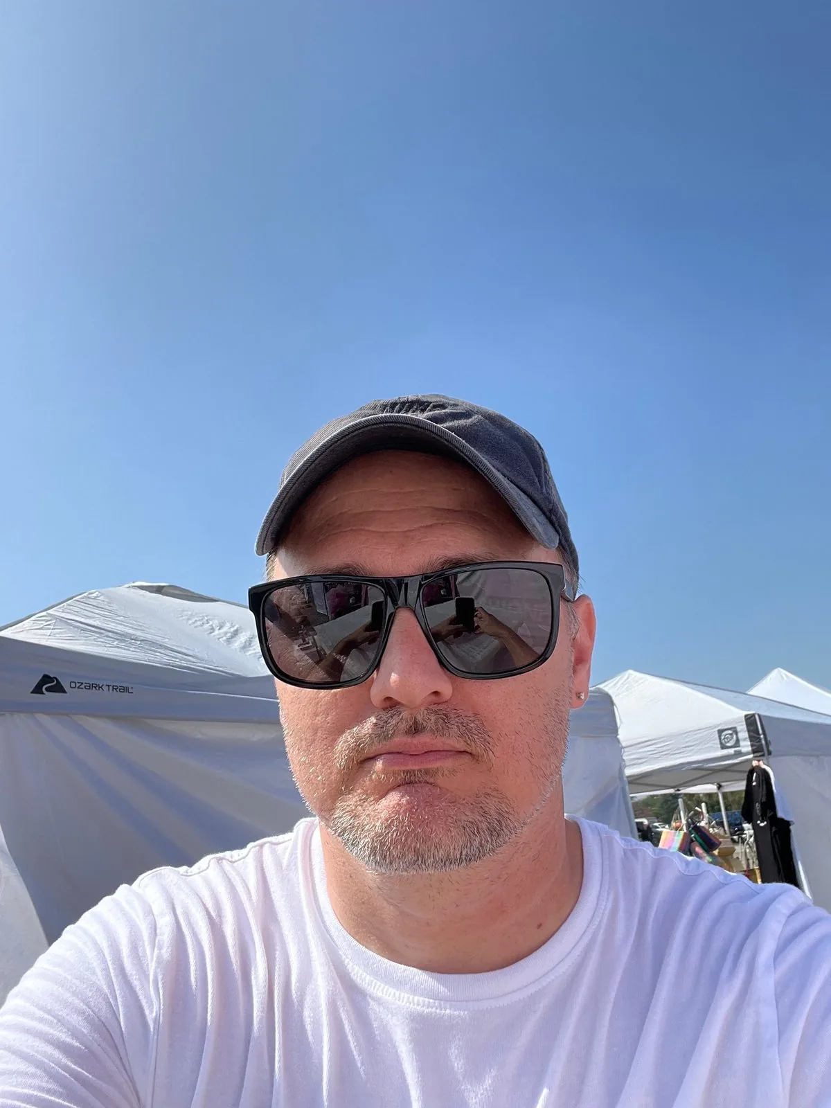 Darrell at an outdoor market on a clear day